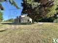 Photo Maison contemporaine avec vue estuaire et terrain