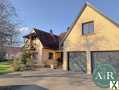 Photo Ensemble immobilier chaleureux situé dans le village de Stotzheim, offrant une parfaite harmonie entre espace de vie et activité professionnelle.