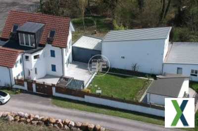 Photo Ensemble immoblier comprenant une maison et un local commercial